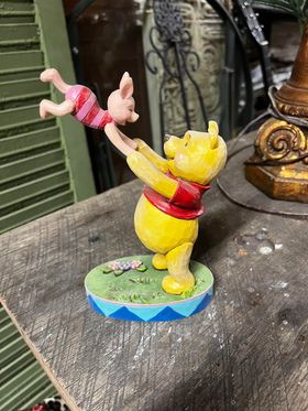 Pooh swinging Piglet